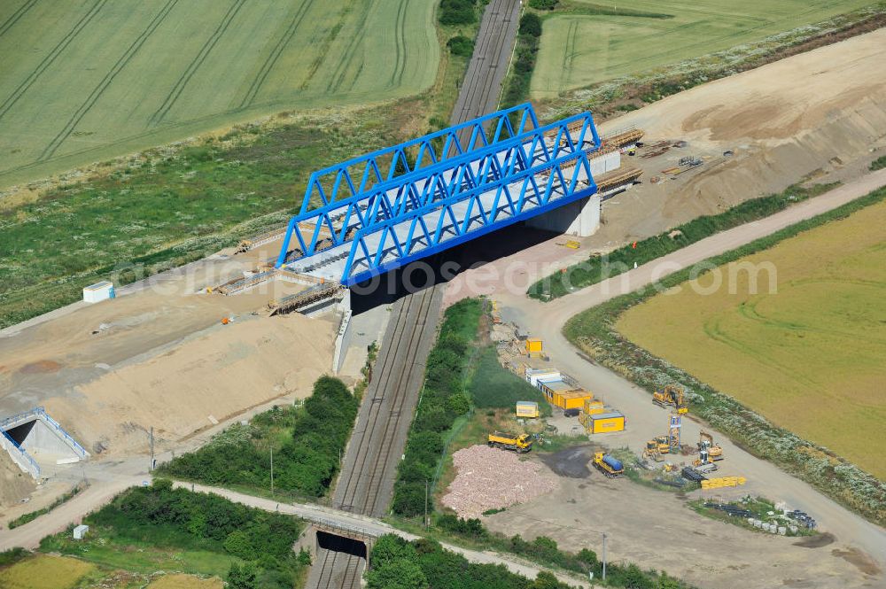 Bernburg from the bird's eye view: Baustelle vom Neubau der Ortsumgehung Bernburg Bundesstraße B 6n mit Anschlußstelle an die Autobahn / Bundesautobahn A 14 in Sachsen-Anhalt. Ein Projekt von EUROVIA. Construction site of the new circuitous road B6n Bernburg with the new junction on to the freeway in the near of Bernburg in Saxony-Anhalt.