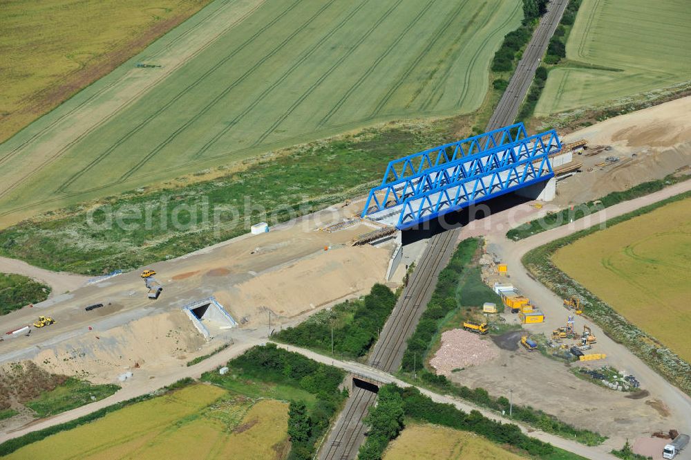 Aerial image Bernburg - Baustelle vom Neubau der Ortsumgehung Bernburg Bundesstraße B 6n mit Anschlußstelle an die Autobahn / Bundesautobahn A 14 in Sachsen-Anhalt. Ein Projekt von EUROVIA. Construction site of the new circuitous road B6n Bernburg with the new junction on to the freeway in the near of Bernburg in Saxony-Anhalt.