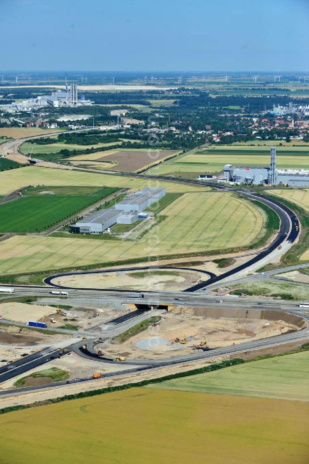 Bernburg from the bird's eye view: Baustelle vom Neubau der Ortsumgehung Bernburg Bundesstraße B 6n mit Anschlußstelle an die Autobahn / Bundesautobahn A 14 in Sachsen-Anhalt. Ein Projekt von EUROVIA. Construction site of the new circuitous road B6n Bernburg with the new junction on to the freeway in the near of Bernburg in Saxony-Anhalt.