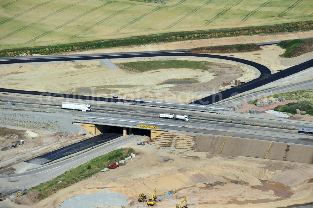 Aerial image Bernburg - Baustelle vom Neubau der Ortsumgehung Bernburg Bundesstraße B 6n mit Anschlußstelle an die Autobahn / Bundesautobahn A 14 in Sachsen-Anhalt. Ein Projekt von EUROVIA. Construction site of the new circuitous road B6n Bernburg with the new junction on to the freeway in the near of Bernburg in Saxony-Anhalt.