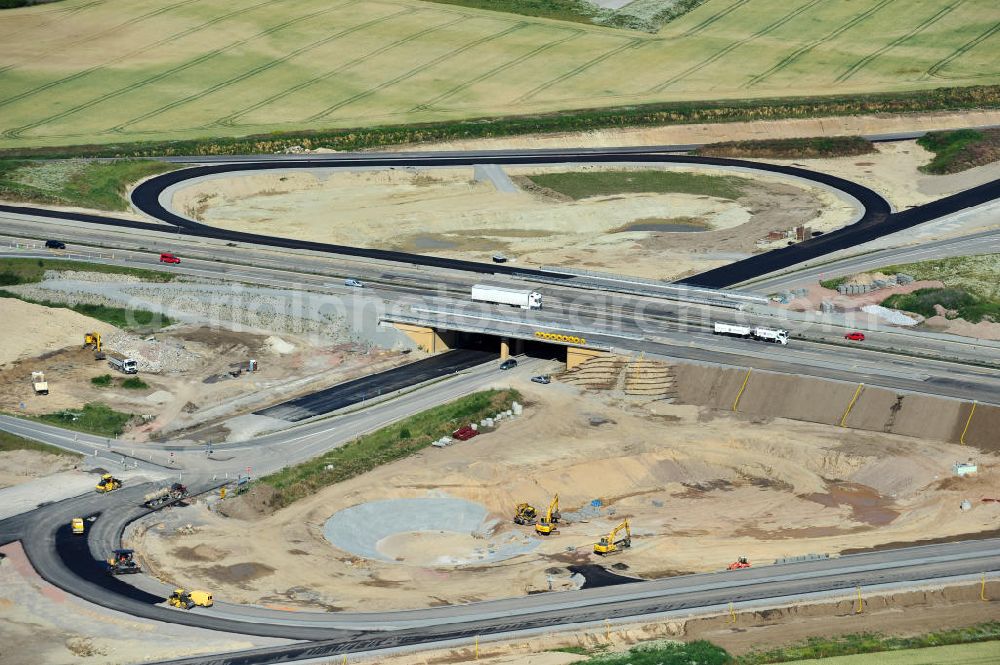 Aerial photograph Bernburg - Baustelle vom Neubau der Ortsumgehung Bernburg Bundesstraße B 6n mit Anschlußstelle an die Autobahn / Bundesautobahn A 14 in Sachsen-Anhalt. Ein Projekt von EUROVIA. Construction site of the new circuitous road B6n Bernburg with the new junction on to the freeway in the near of Bernburg in Saxony-Anhalt.