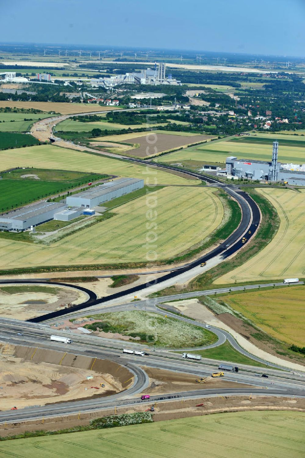 Bernburg from above - Baustelle vom Neubau der Ortsumgehung Bernburg Bundesstraße B 6n mit Anschlußstelle an die Autobahn / Bundesautobahn A 14 in Sachsen-Anhalt. Ein Projekt von EUROVIA. Construction site of the new circuitous road B6n Bernburg with the new junction on to the freeway in the near of Bernburg in Saxony-Anhalt.