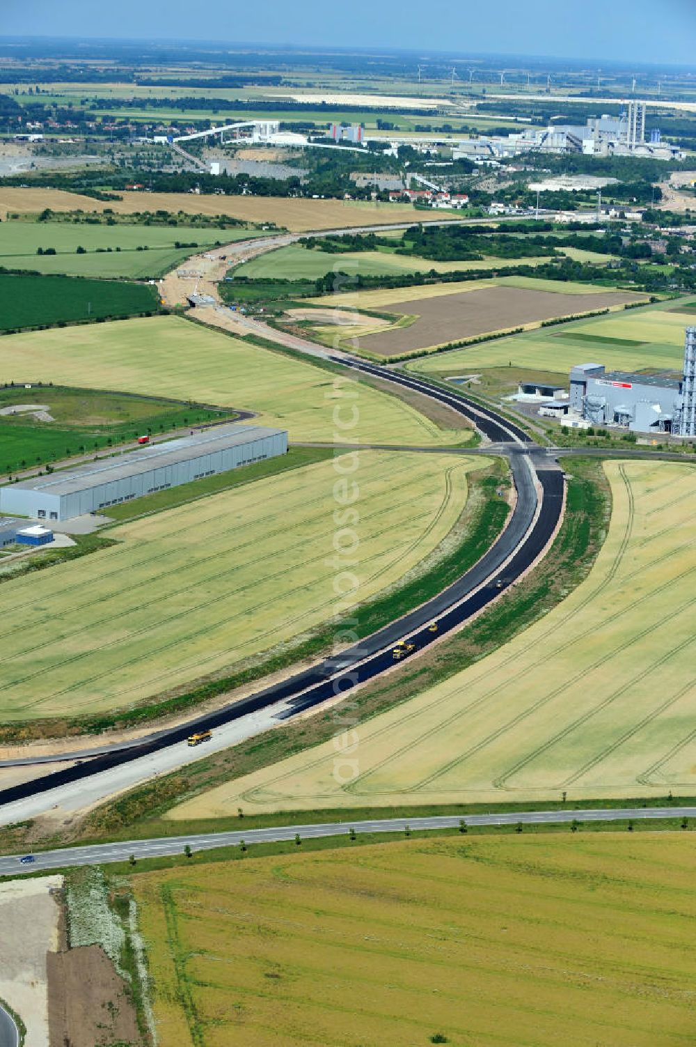 Bernburg from the bird's eye view: Baustelle vom Neubau der Ortsumgehung Bernburg Bundesstraße B 6n mit Anschlußstelle an die Autobahn / Bundesautobahn A 14 in Sachsen-Anhalt. Ein Projekt von EUROVIA. Construction site of the new circuitous road B6n Bernburg with the new junction on to the freeway in the near of Bernburg in Saxony-Anhalt.