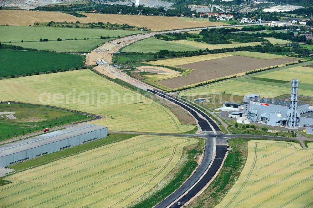 Aerial image Bernburg - Baustelle vom Neubau der Ortsumgehung Bernburg Bundesstraße B 6n mit Anschlußstelle an die Autobahn / Bundesautobahn A 14 in Sachsen-Anhalt. Ein Projekt von EUROVIA. Construction site of the new circuitous road B6n Bernburg with the new junction on to the freeway in the near of Bernburg in Saxony-Anhalt.