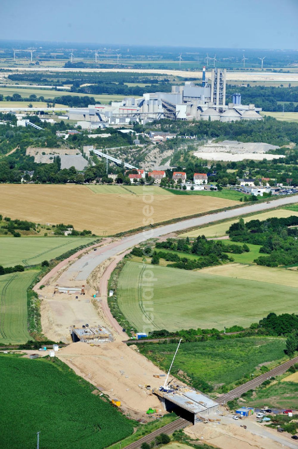 Bernburg from above - Baustelle vom Neubau der Ortsumgehung Bernburg Bundesstraße B 6n mit Anschlußstelle an die Autobahn / Bundesautobahn A 14 in Sachsen-Anhalt. Ein Projekt von EUROVIA. Construction site of the new circuitous road B6n Bernburg with the new junction on to the freeway in the near of Bernburg in Saxony-Anhalt.