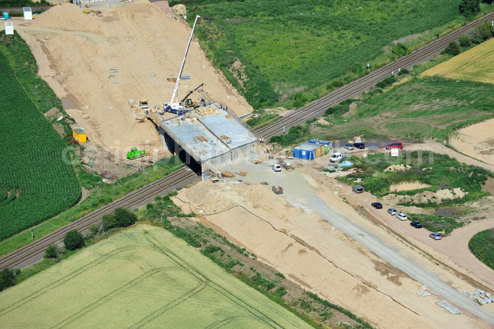 Aerial image Bernburg - Baustelle vom Neubau der Ortsumgehung Bernburg Bundesstraße B 6n mit Anschlußstelle an die Autobahn / Bundesautobahn A 14 in Sachsen-Anhalt. Ein Projekt von EUROVIA. Construction site of the new circuitous road B6n Bernburg with the new junction on to the freeway in the near of Bernburg in Saxony-Anhalt.