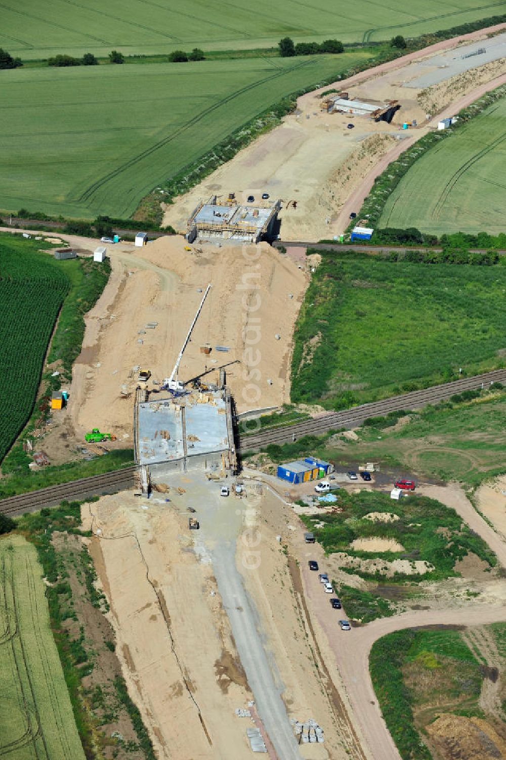 Aerial photograph Bernburg - Baustelle vom Neubau der Ortsumgehung Bernburg Bundesstraße B 6n mit Anschlußstelle an die Autobahn / Bundesautobahn A 14 in Sachsen-Anhalt. Ein Projekt von EUROVIA. Construction site of the new circuitous road B6n Bernburg with the new junction on to the freeway in the near of Bernburg in Saxony-Anhalt.