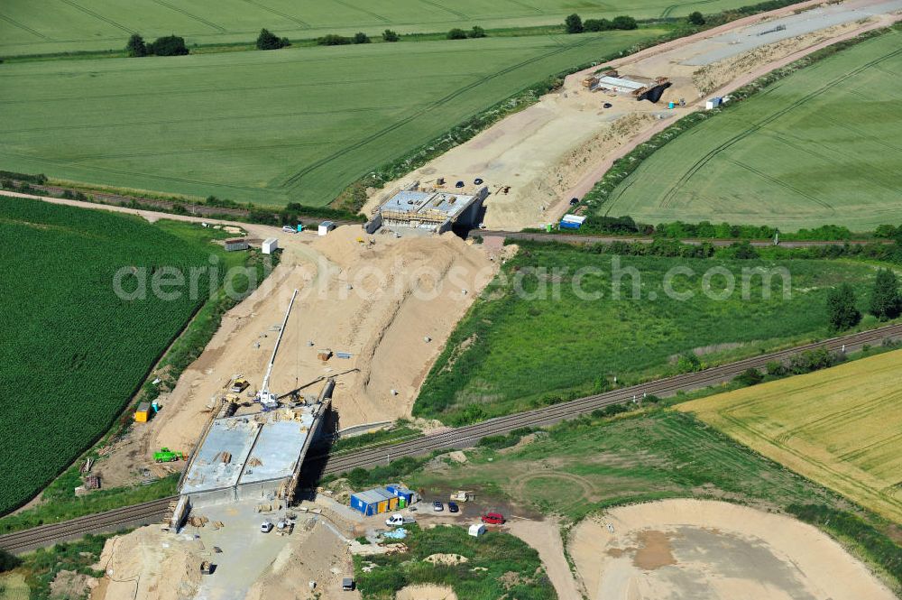 Bernburg from above - Baustelle vom Neubau der Ortsumgehung Bernburg Bundesstraße B 6n mit Anschlußstelle an die Autobahn / Bundesautobahn A 14 in Sachsen-Anhalt. Ein Projekt von EUROVIA. Construction site of the new circuitous road B6n Bernburg with the new junction on to the freeway in the near of Bernburg in Saxony-Anhalt.