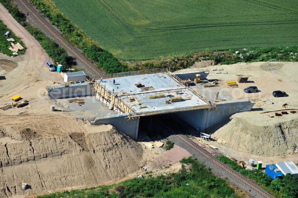 Aerial image Bernburg - Baustelle vom Neubau der Ortsumgehung Bernburg Bundesstraße B 6n mit Anschlußstelle an die Autobahn / Bundesautobahn A 14 in Sachsen-Anhalt. Ein Projekt von EUROVIA. Construction site of the new circuitous road B6n Bernburg with the new junction on to the freeway in the near of Bernburg in Saxony-Anhalt.