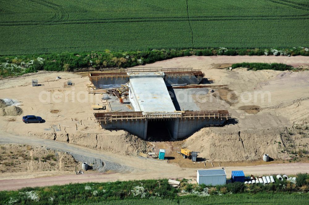 Aerial photograph Bernburg - Baustelle vom Neubau der Ortsumgehung Bernburg Bundesstraße B 6n mit Anschlußstelle an die Autobahn / Bundesautobahn A 14 in Sachsen-Anhalt. Ein Projekt von EUROVIA. Construction site of the new circuitous road B6n Bernburg with the new junction on to the freeway in the near of Bernburg in Saxony-Anhalt.