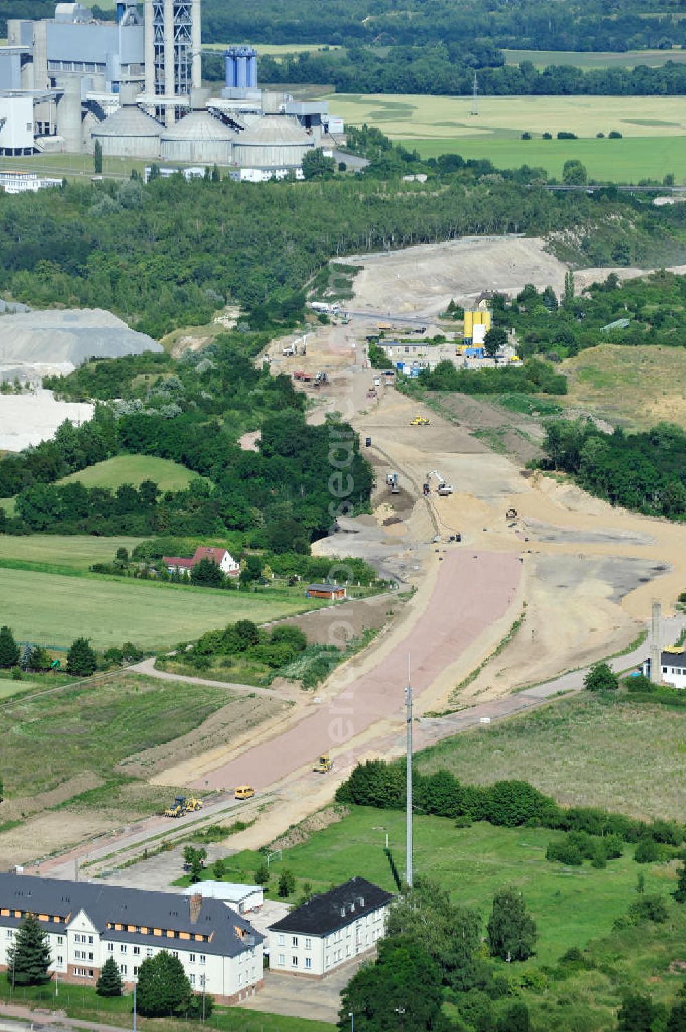 Bernburg from above - Baustelle vom Neubau der Ortsumgehung Bernburg Bundesstraße B 6n mit Anschlußstelle an die Autobahn / Bundesautobahn A 14 in Sachsen-Anhalt. Ein Projekt von EUROVIA. Construction site of the new circuitous road B6n Bernburg with the new junction on to the freeway in the near of Bernburg in Saxony-Anhalt.