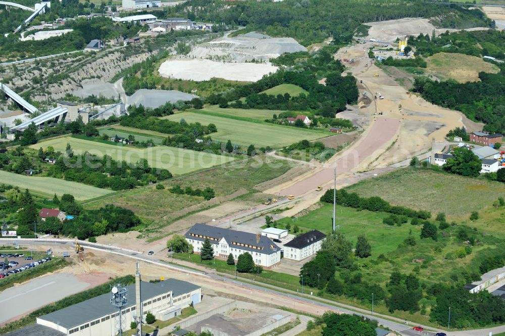 Bernburg from the bird's eye view: Baustelle vom Neubau der Ortsumgehung Bernburg Bundesstraße B 6n mit Anschlußstelle an die Autobahn / Bundesautobahn A 14 in Sachsen-Anhalt. Ein Projekt von EUROVIA. Construction site of the new circuitous road B6n Bernburg with the new junction on to the freeway in the near of Bernburg in Saxony-Anhalt.