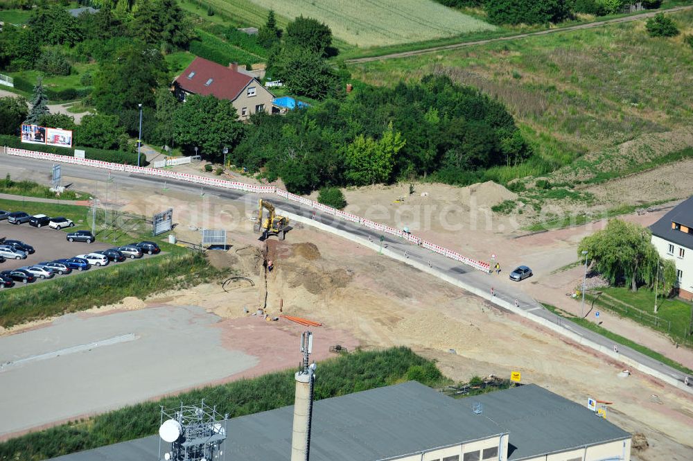 Aerial image Bernburg - Baustelle vom Neubau der Ortsumgehung Bernburg Bundesstraße B 6n mit Anschlußstelle an die Autobahn / Bundesautobahn A 14 in Sachsen-Anhalt. Ein Projekt von EUROVIA. Construction site of the new circuitous road B6n Bernburg with the new junction on to the freeway in the near of Bernburg in Saxony-Anhalt.