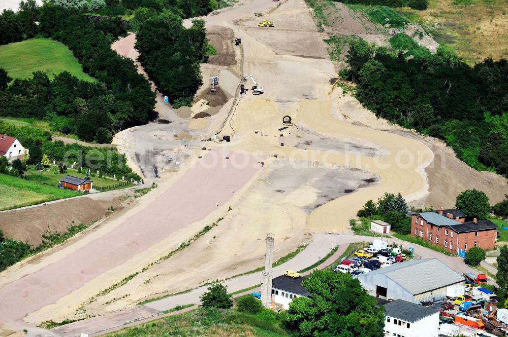 Aerial photograph Bernburg - Baustelle vom Neubau der Ortsumgehung Bernburg Bundesstraße B 6n mit Anschlußstelle an die Autobahn / Bundesautobahn A 14 in Sachsen-Anhalt. Ein Projekt von EUROVIA. Construction site of the new circuitous road B6n Bernburg with the new junction on to the freeway in the near of Bernburg in Saxony-Anhalt.