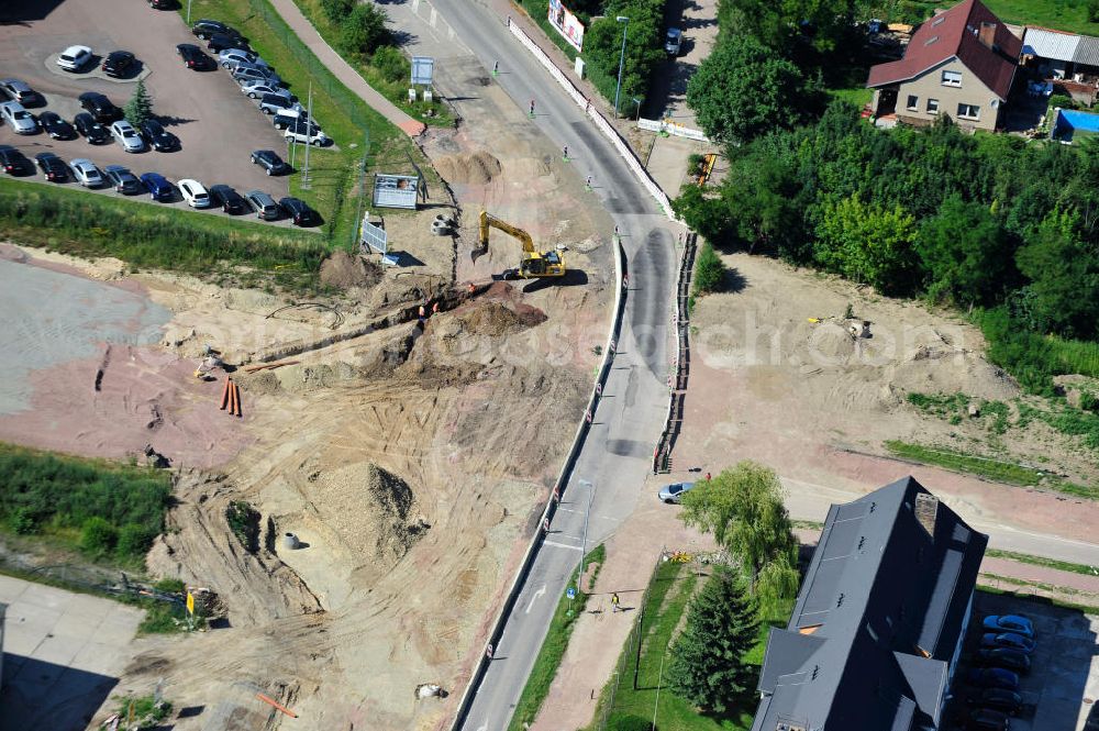 Bernburg from the bird's eye view: Baustelle vom Neubau der Ortsumgehung Bernburg Bundesstraße B 6n mit Anschlußstelle an die Autobahn / Bundesautobahn A 14 in Sachsen-Anhalt. Ein Projekt von EUROVIA. Construction site of the new circuitous road B6n Bernburg with the new junction on to the freeway in the near of Bernburg in Saxony-Anhalt.