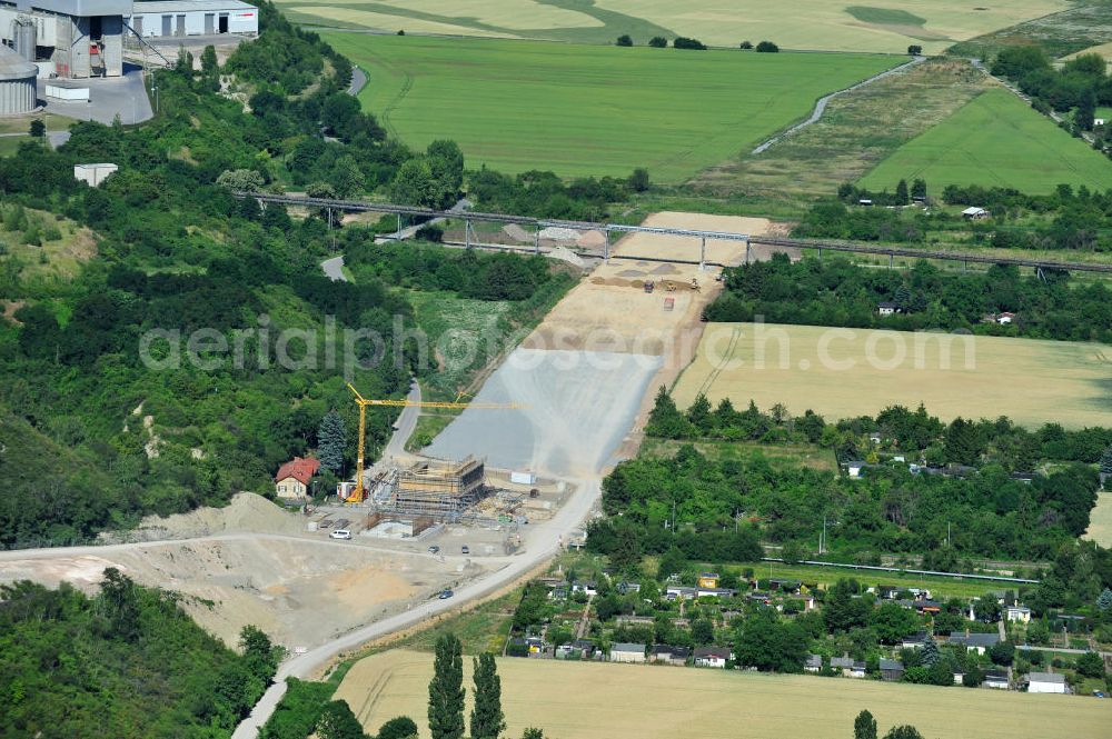 Bernburg from above - Baustelle vom Neubau der Ortsumgehung Bernburg Bundesstraße B 6n mit Anschlußstelle an die Autobahn / Bundesautobahn A 14 in Sachsen-Anhalt. Ein Projekt von EUROVIA. Construction site of the new circuitous road B6n Bernburg with the new junction on to the freeway in the near of Bernburg in Saxony-Anhalt.