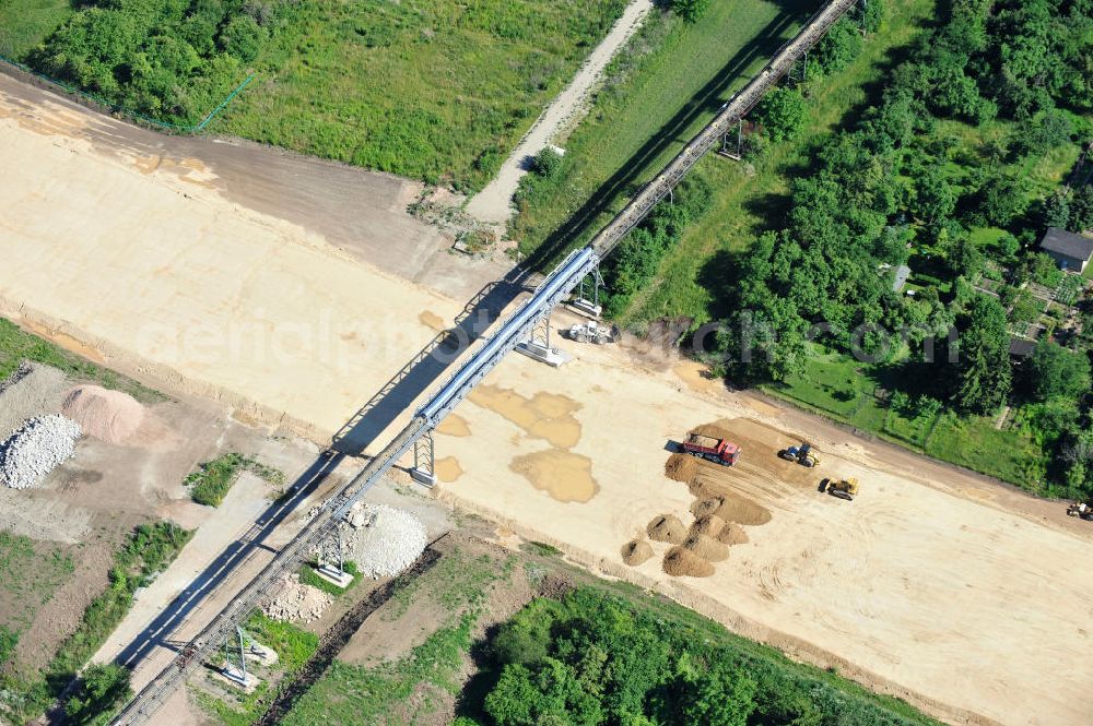 Bernburg from above - Baustelle vom Neubau der Ortsumgehung Bernburg Bundesstraße B 6n mit Anschlußstelle an die Autobahn / Bundesautobahn A 14 in Sachsen-Anhalt. Ein Projekt von EUROVIA. Construction site of the new circuitous road B6n Bernburg with the new junction on to the freeway in the near of Bernburg in Saxony-Anhalt.