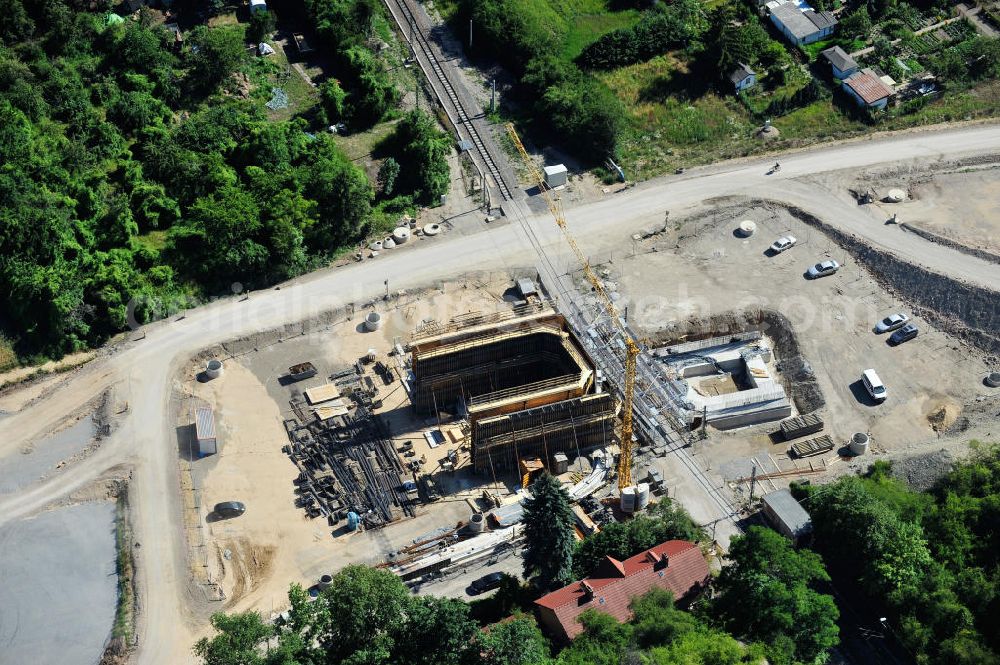 Bernburg from the bird's eye view: Baustelle vom Neubau der Ortsumgehung Bernburg Bundesstraße B 6n mit Anschlußstelle an die Autobahn / Bundesautobahn A 14 in Sachsen-Anhalt. Ein Projekt von EUROVIA. Construction site of the new circuitous road B6n Bernburg with the new junction on to the freeway in the near of Bernburg in Saxony-Anhalt.