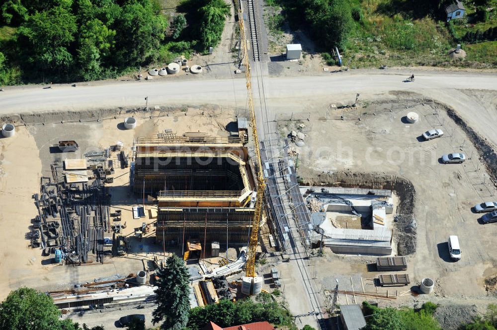 Aerial image Bernburg - Baustelle vom Neubau der Ortsumgehung Bernburg Bundesstraße B 6n mit Anschlußstelle an die Autobahn / Bundesautobahn A 14 in Sachsen-Anhalt. Ein Projekt von EUROVIA. Construction site of the new circuitous road B6n Bernburg with the new junction on to the freeway in the near of Bernburg in Saxony-Anhalt.