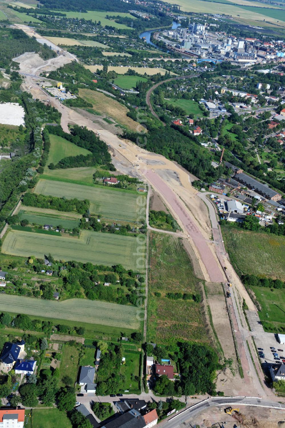 Bernburg from the bird's eye view: Baustelle vom Neubau der Ortsumgehung Bernburg Bundesstraße B 6n mit Anschlußstelle an die Autobahn / Bundesautobahn A 14 in Sachsen-Anhalt. Ein Projekt von EUROVIA. Construction site of the new circuitous road B6n Bernburg with the new junction on to the freeway in the near of Bernburg in Saxony-Anhalt.