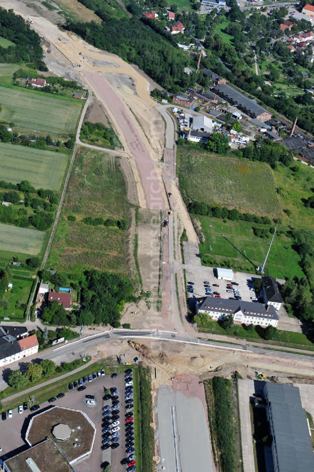 Aerial image Bernburg - Baustelle vom Neubau der Ortsumgehung Bernburg Bundesstraße B 6n mit Anschlußstelle an die Autobahn / Bundesautobahn A 14 in Sachsen-Anhalt. Ein Projekt von EUROVIA. Construction site of the new circuitous road B6n Bernburg with the new junction on to the freeway in the near of Bernburg in Saxony-Anhalt.