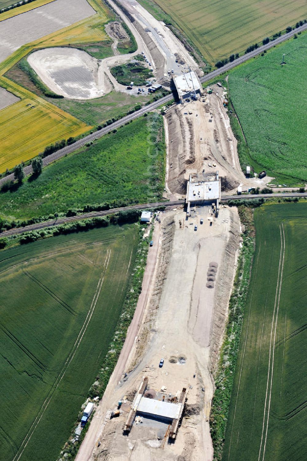 Aerial photograph Bernburg - Baustelle vom Neubau der Ortsumgehung Bernburg Bundesstraße B 6n mit Anschlußstelle an die Autobahn / Bundesautobahn A 14 in Sachsen-Anhalt. Ein Projekt von EUROVIA. Construction site of the new circuitous road B6n Bernburg with the new junction on to the freeway in the near of Bernburg in Saxony-Anhalt.