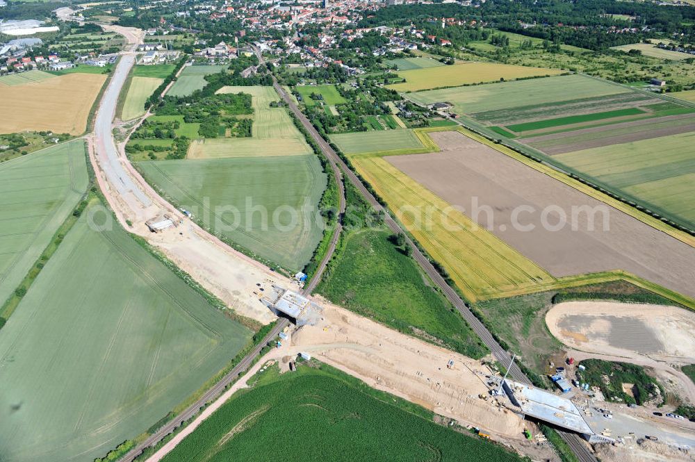 Bernburg from above - Baustelle vom Neubau der Ortsumgehung Bernburg Bundesstraße B 6n mit Anschlußstelle an die Autobahn / Bundesautobahn A 14 in Sachsen-Anhalt. Ein Projekt von EUROVIA. Construction site of the new circuitous road B6n Bernburg with the new junction on to the freeway in the near of Bernburg in Saxony-Anhalt.