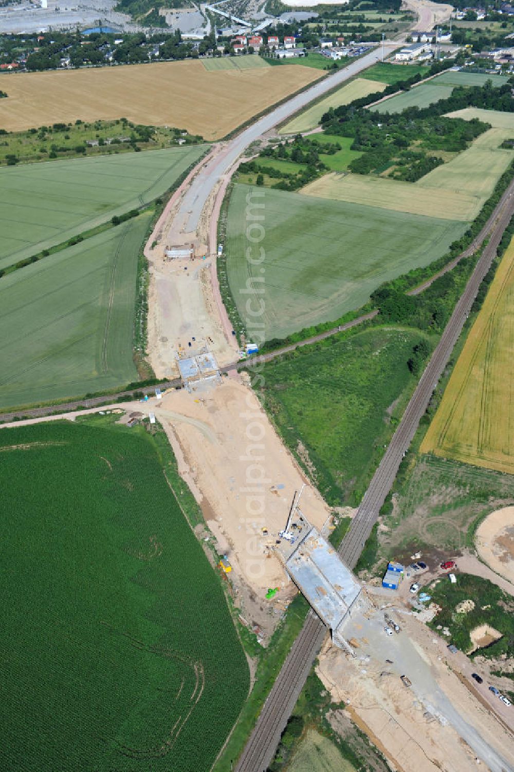 Bernburg from the bird's eye view: Baustelle vom Neubau der Ortsumgehung Bernburg Bundesstraße B 6n mit Anschlußstelle an die Autobahn / Bundesautobahn A 14 in Sachsen-Anhalt. Ein Projekt von EUROVIA. Construction site of the new circuitous road B6n Bernburg with the new junction on to the freeway in the near of Bernburg in Saxony-Anhalt.