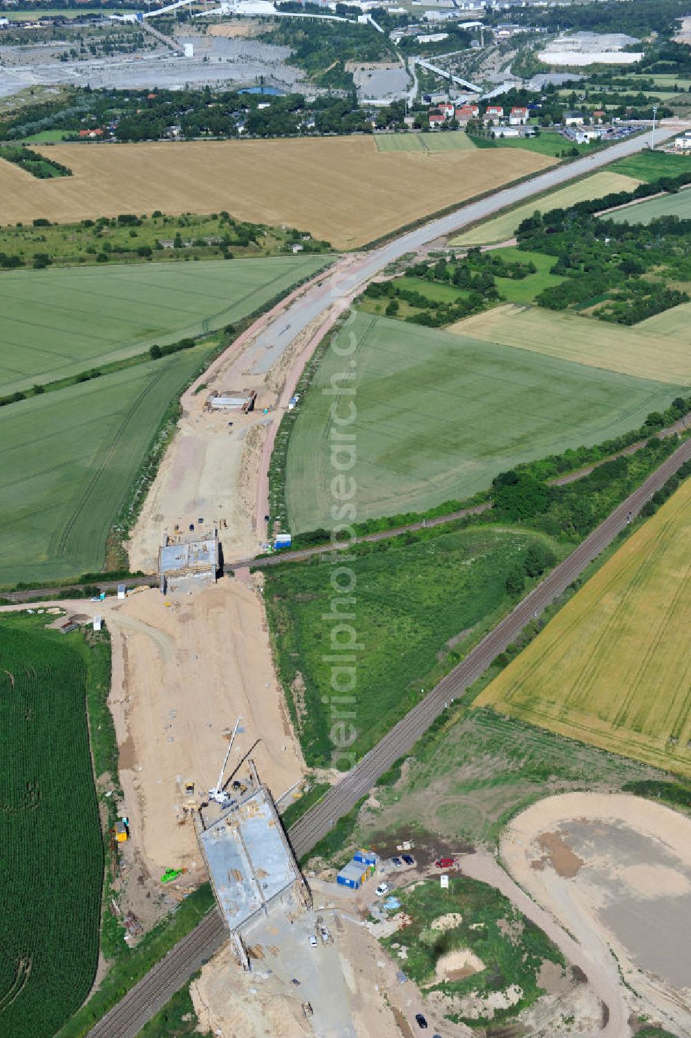 Aerial image Bernburg - Baustelle vom Neubau der Ortsumgehung Bernburg Bundesstraße B 6n mit Anschlußstelle an die Autobahn / Bundesautobahn A 14 in Sachsen-Anhalt. Ein Projekt von EUROVIA. Construction site of the new circuitous road B6n Bernburg with the new junction on to the freeway in the near of Bernburg in Saxony-Anhalt.