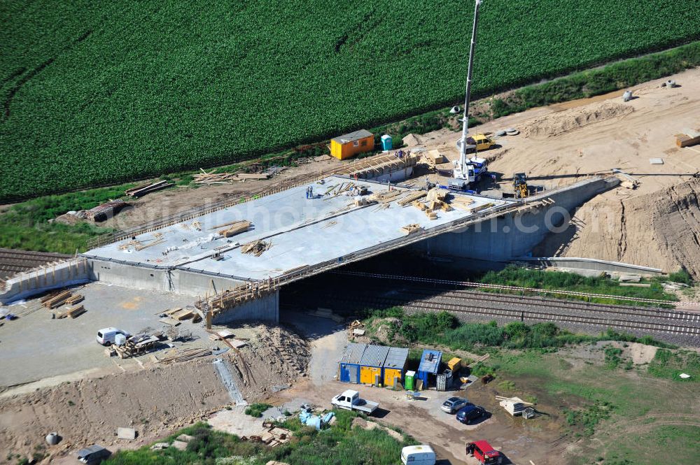 Aerial photograph Bernburg - Baustelle vom Neubau der Ortsumgehung Bernburg Bundesstraße B 6n mit Anschlußstelle an die Autobahn / Bundesautobahn A 14 in Sachsen-Anhalt. Ein Projekt von EUROVIA. Construction site of the new circuitous road B6n Bernburg with the new junction on to the freeway in the near of Bernburg in Saxony-Anhalt.