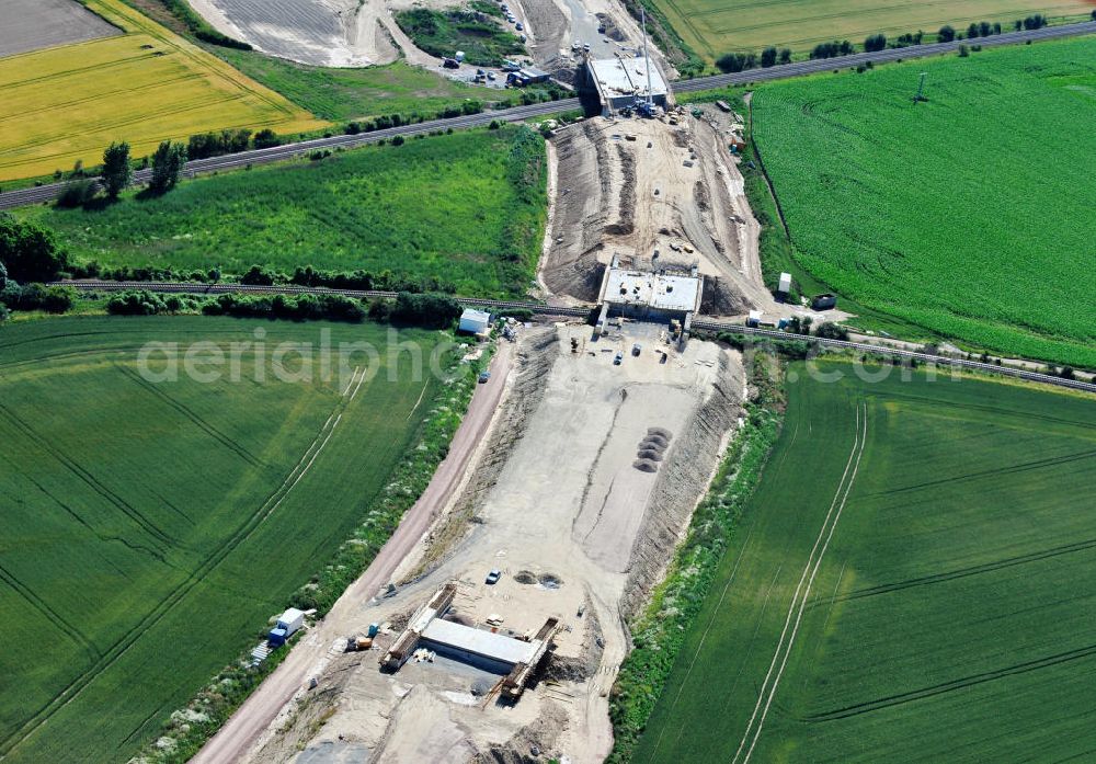 Bernburg from above - Baustelle vom Neubau der Ortsumgehung Bernburg Bundesstraße B 6n mit Anschlußstelle an die Autobahn / Bundesautobahn A 14 in Sachsen-Anhalt. Ein Projekt von EUROVIA. Construction site of the new circuitous road B6n Bernburg with the new junction on to the freeway in the near of Bernburg in Saxony-Anhalt.