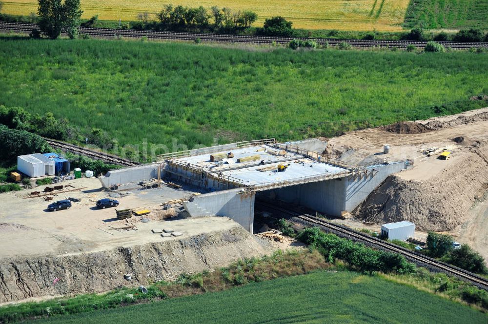 Aerial image Bernburg - Baustelle vom Neubau der Ortsumgehung Bernburg Bundesstraße B 6n mit Anschlußstelle an die Autobahn / Bundesautobahn A 14 in Sachsen-Anhalt. Ein Projekt von EUROVIA. Construction site of the new circuitous road B6n Bernburg with the new junction on to the freeway in the near of Bernburg in Saxony-Anhalt.