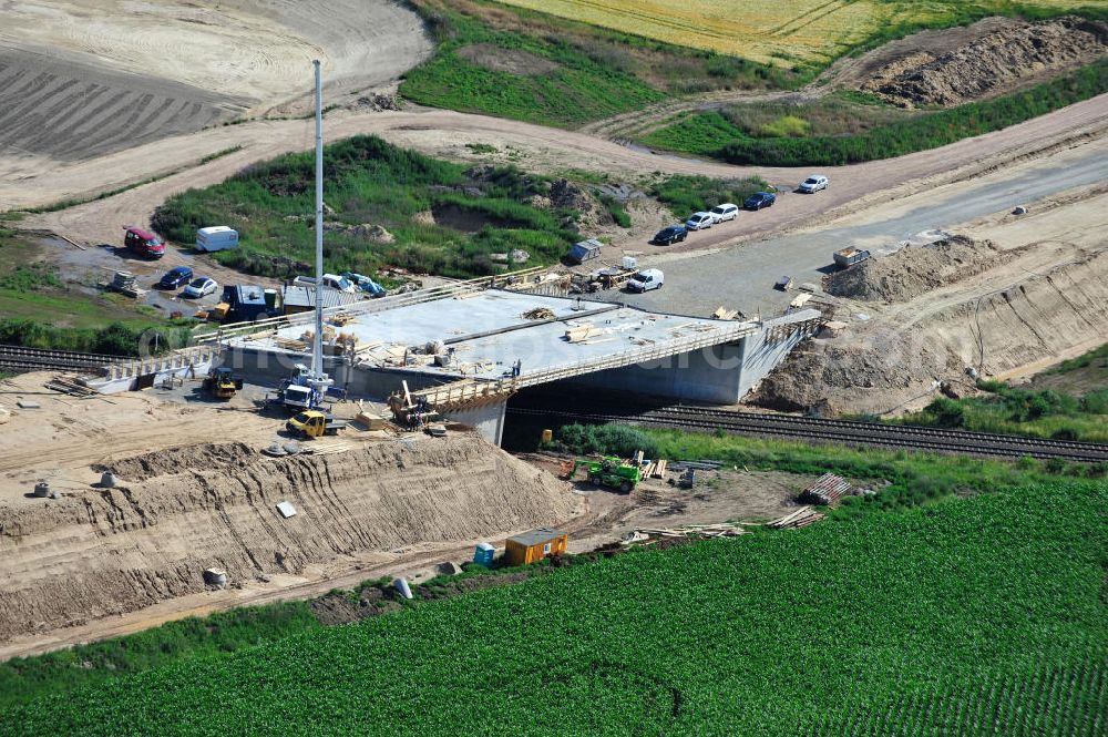 Aerial photograph Bernburg - Baustelle vom Neubau der Ortsumgehung Bernburg Bundesstraße B 6n mit Anschlußstelle an die Autobahn / Bundesautobahn A 14 in Sachsen-Anhalt. Ein Projekt von EUROVIA. Construction site of the new circuitous road B6n Bernburg with the new junction on to the freeway in the near of Bernburg in Saxony-Anhalt.