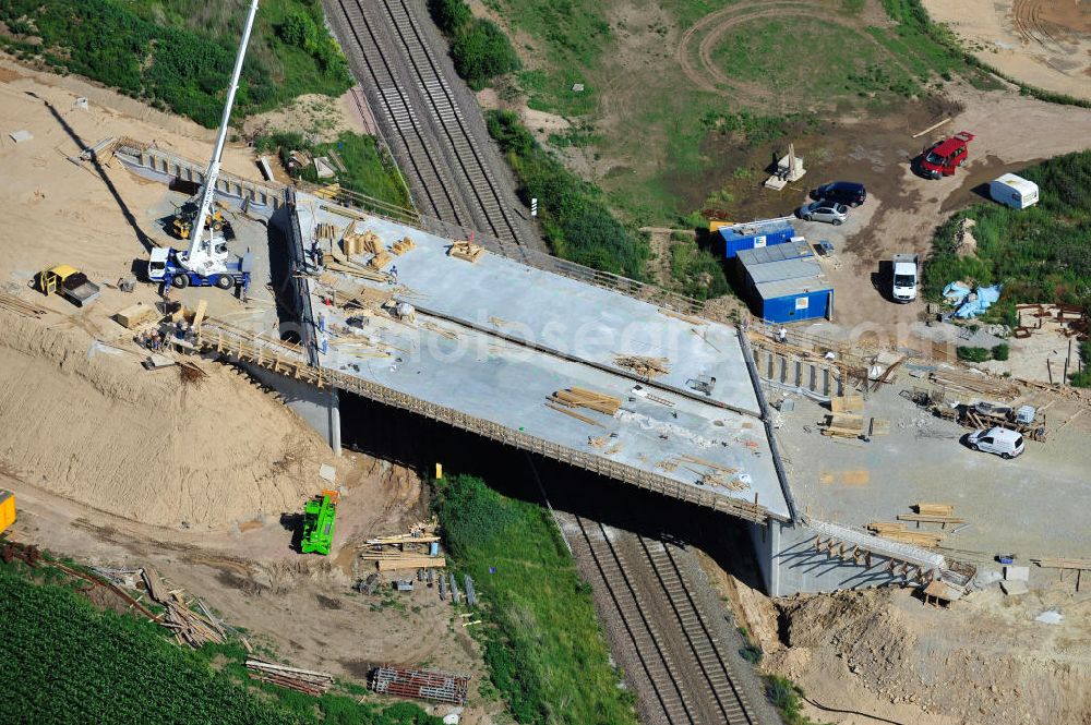 Bernburg from above - Baustelle vom Neubau der Ortsumgehung Bernburg Bundesstraße B 6n mit Anschlußstelle an die Autobahn / Bundesautobahn A 14 in Sachsen-Anhalt. Ein Projekt von EUROVIA. Construction site of the new circuitous road B6n Bernburg with the new junction on to the freeway in the near of Bernburg in Saxony-Anhalt.