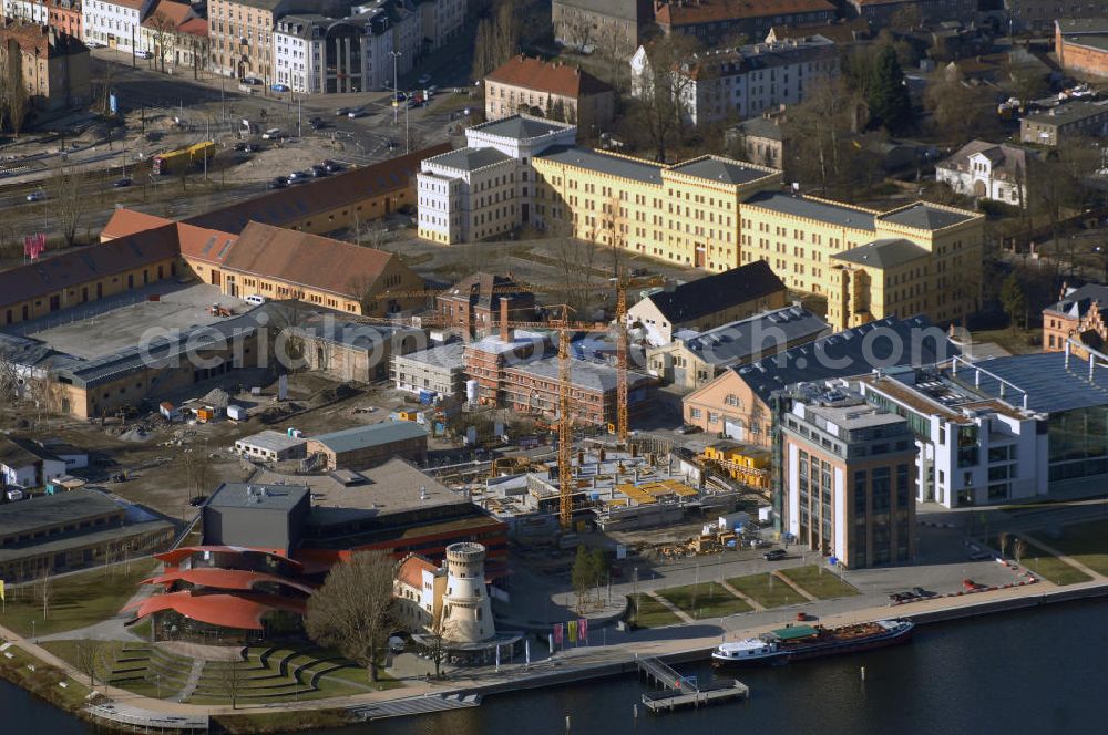 Potsdam from the bird's eye view: Blick auf den Bau des Parkhaus am Hans Otto Theater in Potsdam. Potsdam ist die Hauptstadt des Landes Brandenburg. Sie grenzt im Nordosten unmittelbar an die deutsche Hauptstadt Berlin. Seit September 2006 spielt das Potsdamer Ensemble im neuen Theaterhaus an der Schiffbauergasse. Im Parkhaus sollen ab April 354 Autos Platz haben. Besondere Aufmerksamkeit erfuhr der Neubau durch den Eklat um die Behindertentoilette. Zuständig für den Bau ist das Architektur- und Ingenieurbüro Kock & Lünz, Menzelstr. 5, 14467 Potsdam, Tel.: 0331201540