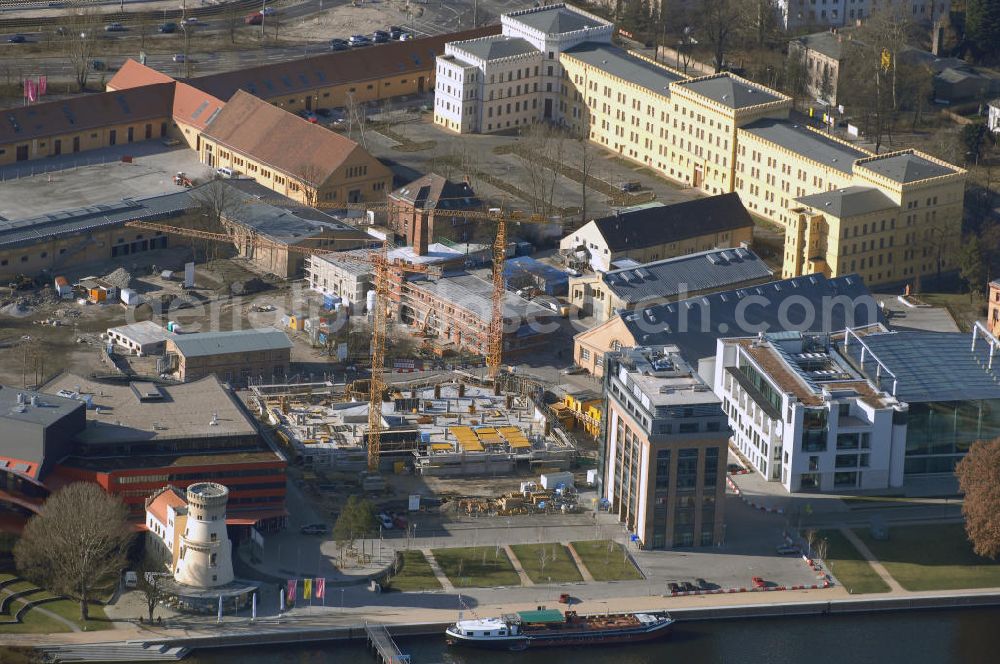 Aerial image Potsdam - Blick auf den Bau des Parkhaus am Hans Otto Theater in Potsdam. Potsdam ist die Hauptstadt des Landes Brandenburg. Sie grenzt im Nordosten unmittelbar an die deutsche Hauptstadt Berlin. Seit September 2006 spielt das Potsdamer Ensemble im neuen Theaterhaus an der Schiffbauergasse. Im Parkhaus sollen ab April 354 Autos Platz haben. Besondere Aufmerksamkeit erfuhr der Neubau durch den Eklat um die Behindertentoilette. Zuständig für den Bau ist das Architektur- und Ingenieurbüro Kock & Lünz, Menzelstr. 5, 14467 Potsdam, Tel.: 0331201540