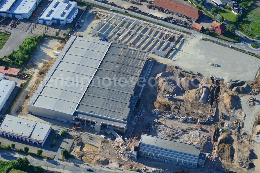 Aerial image Einbeck - Construction site of Poser Park in the city of Einbeck in the region of Südniedersachsen in the state of Lower Saxony. The new business park will be located on site of the old carpentry factory Walter Poser Globus in the West of the urban area. Different shops and companies will be located here, the old factory is being destructed