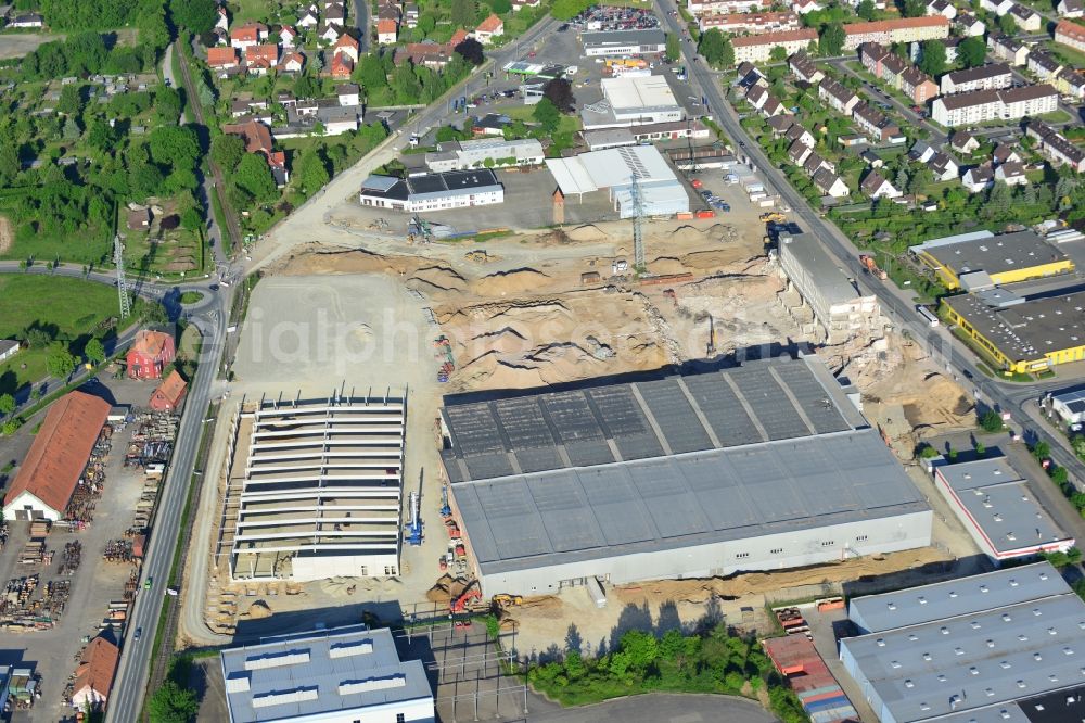 Einbeck from the bird's eye view: Construction site of Poser Park in the city of Einbeck in the region of Südniedersachsen in the state of Lower Saxony. The new business park will be located on site of the old carpentry factory Walter Poser Globus in the West of the urban area. Different shops and companies will be located here, the old factory is being destructed