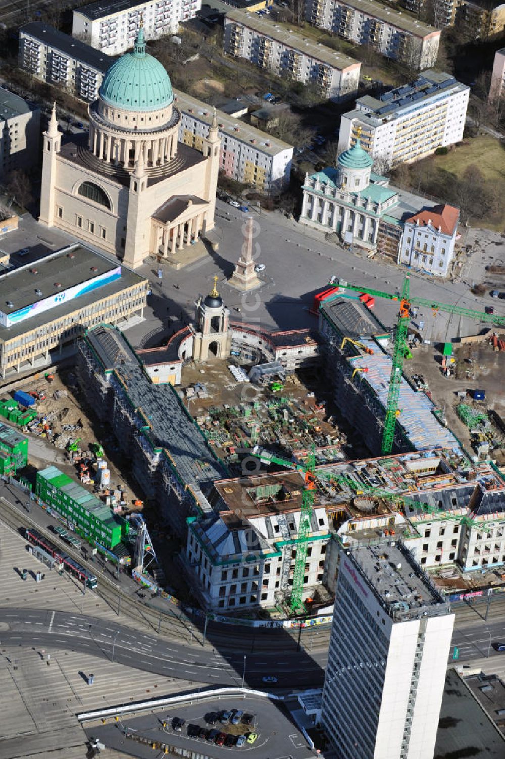 Potsdam from the bird's eye view: Construction site of the Potsdam Stadtschloss at the Old Market. In the background is the University of Applied Sciences Potsdam and St. Nikolai Church. Building contractors company: BAM Deutschland AG