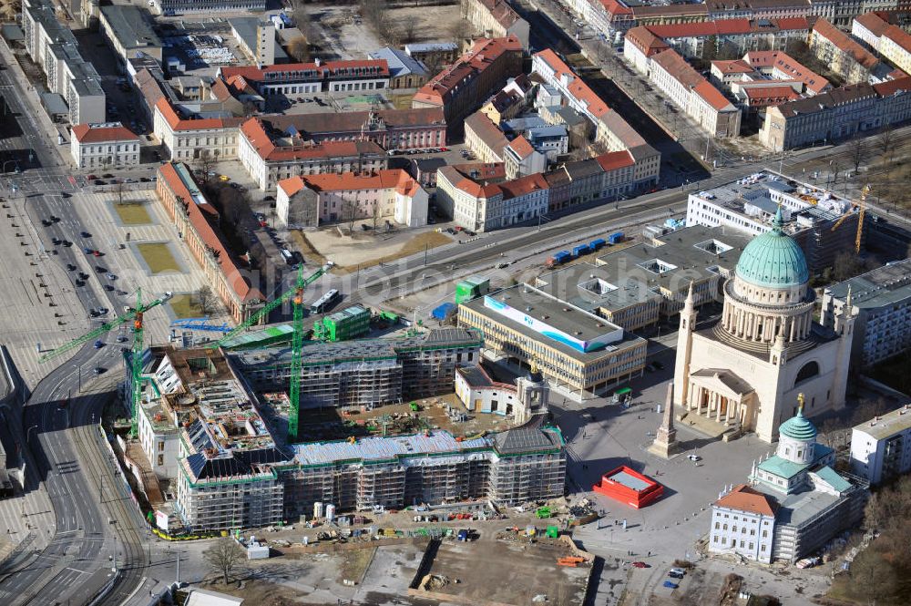 Potsdam from the bird's eye view: Construction site of the Potsdam Stadtschloss at the Old Market. In the background is the University of Applied Sciences Potsdam and St. Nikolai Church. Building contractors company: BAM Deutschland AG