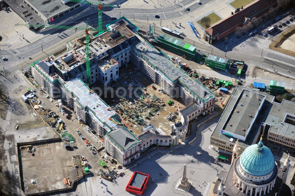 Potsdam from the bird's eye view: Construction site of the Potsdam Stadtschloss at the Old Market. In the background is the University of Applied Sciences Potsdam and St. Nikolai Church. Building contractors company: BAM Deutschland AG