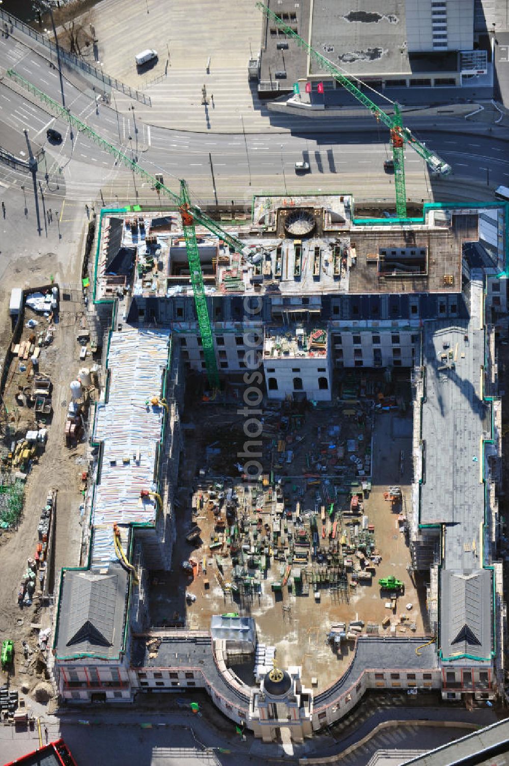 Potsdam from the bird's eye view: Construction site of the Potsdam Stadtschloss at the Old Market. In the background is the University of Applied Sciences Potsdam and St. Nikolai Church. Building contractors company: BAM Deutschland AG