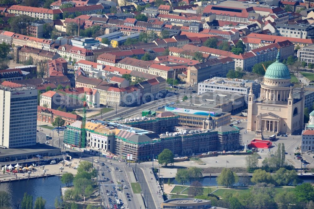 Potsdam from the bird's eye view: Construction site of the Potsdam Stadtschloss at the Old Market. In the background is the University of Applied Sciences Potsdam and St. Nikolai Church. Building contractors company: BAM Deutschland AG