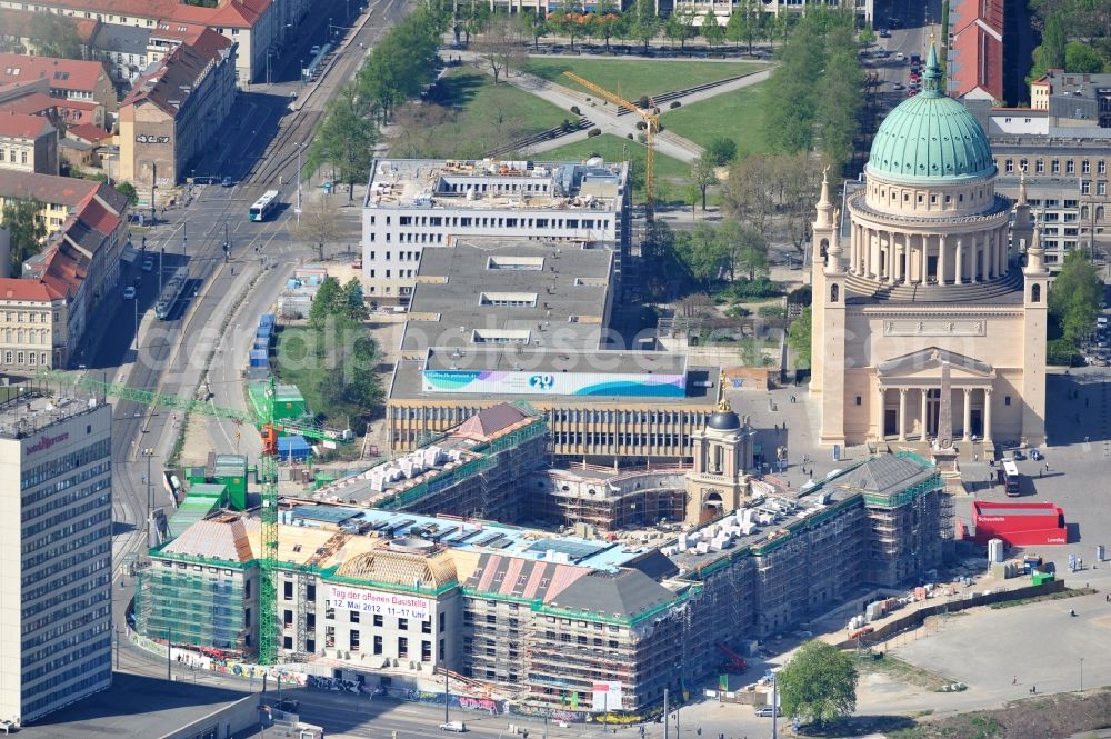 Potsdam from the bird's eye view: Construction site of the Potsdam Stadtschloss at the Old Market. In the background is the University of Applied Sciences Potsdam and St. Nikolai Church. Building contractors company: BAM Deutschland AG