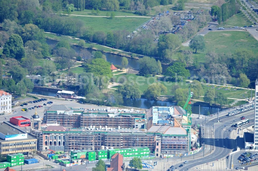 Potsdam from the bird's eye view: Construction site of the Potsdam Stadtschloss at the Old Market. In the background is the University of Applied Sciences Potsdam and St. Nikolai Church. Building contractors company: BAM Deutschland AG