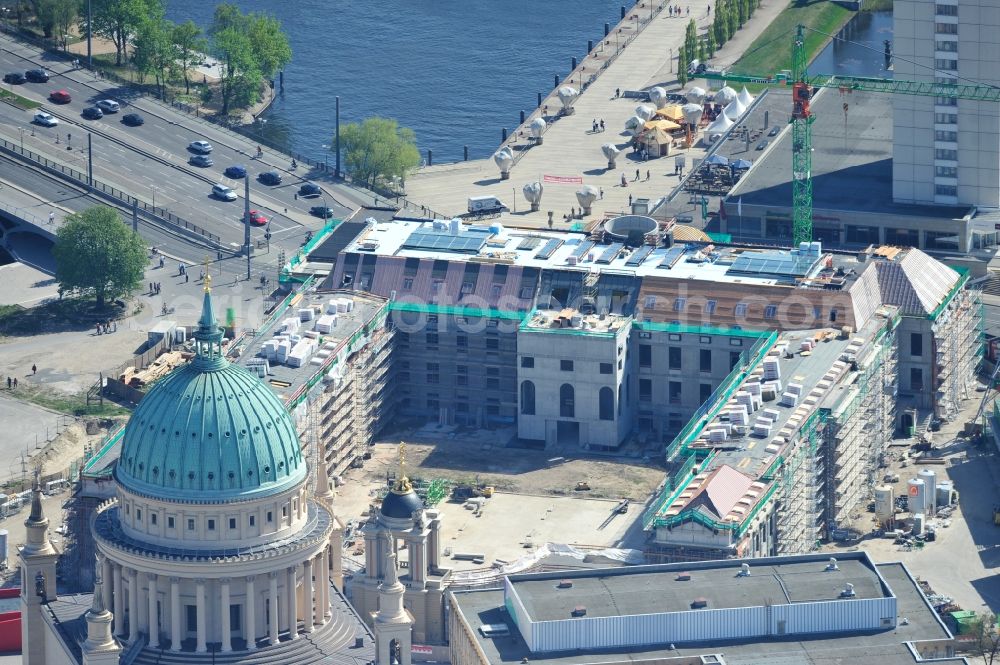 Aerial photograph Potsdam - Construction site of the Potsdam Stadtschloss at the Old Market. In the background is the University of Applied Sciences Potsdam and St. Nikolai Church. Building contractors company: BAM Deutschland AG