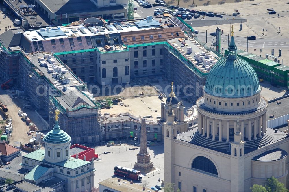 Potsdam from the bird's eye view: Construction site of the Potsdam Stadtschloss at the Old Market. In the background is the University of Applied Sciences Potsdam and St. Nikolai Church. Building contractors company: BAM Deutschland AG