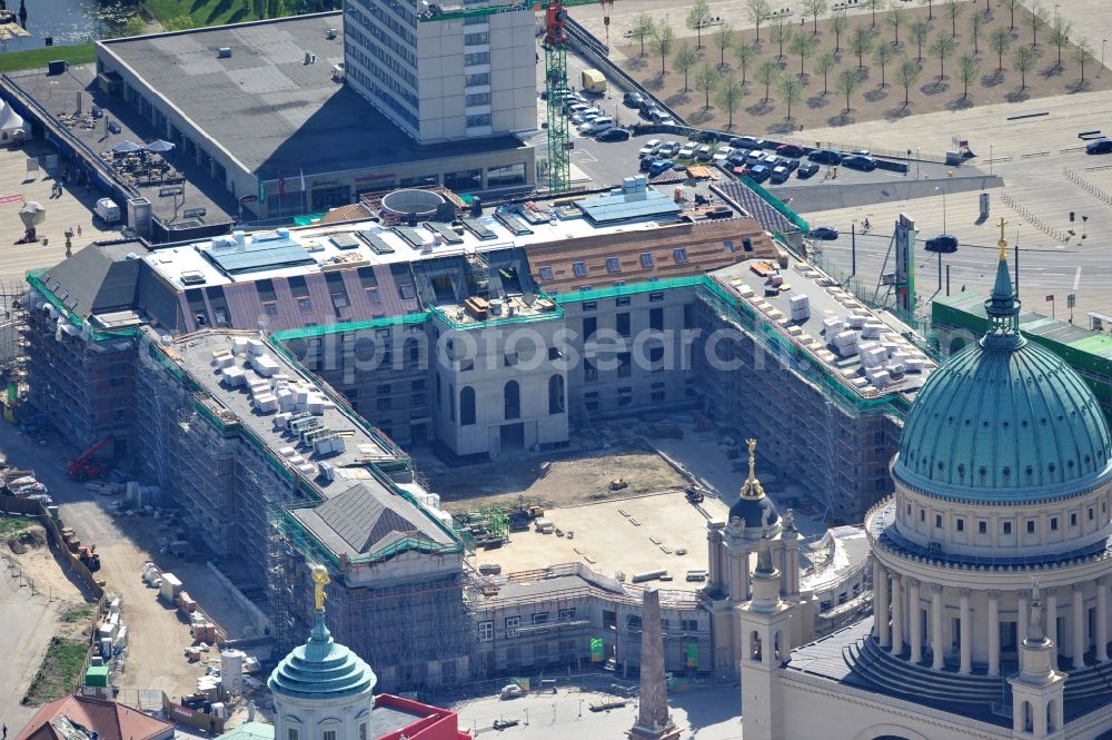 Aerial image Potsdam - Construction site of the Potsdam Stadtschloss at the Old Market. In the background is the University of Applied Sciences Potsdam and St. Nikolai Church. Building contractors company: BAM Deutschland AG