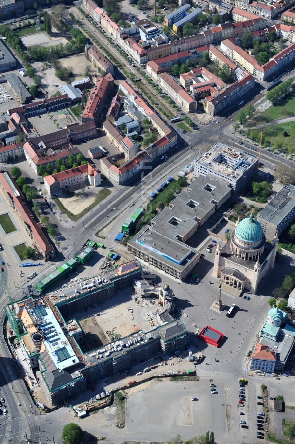 Potsdam from the bird's eye view: Construction site of the Potsdam Stadtschloss at the Old Market. In the background is the University of Applied Sciences Potsdam and St. Nikolai Church. Building contractors company: BAM Deutschland AG