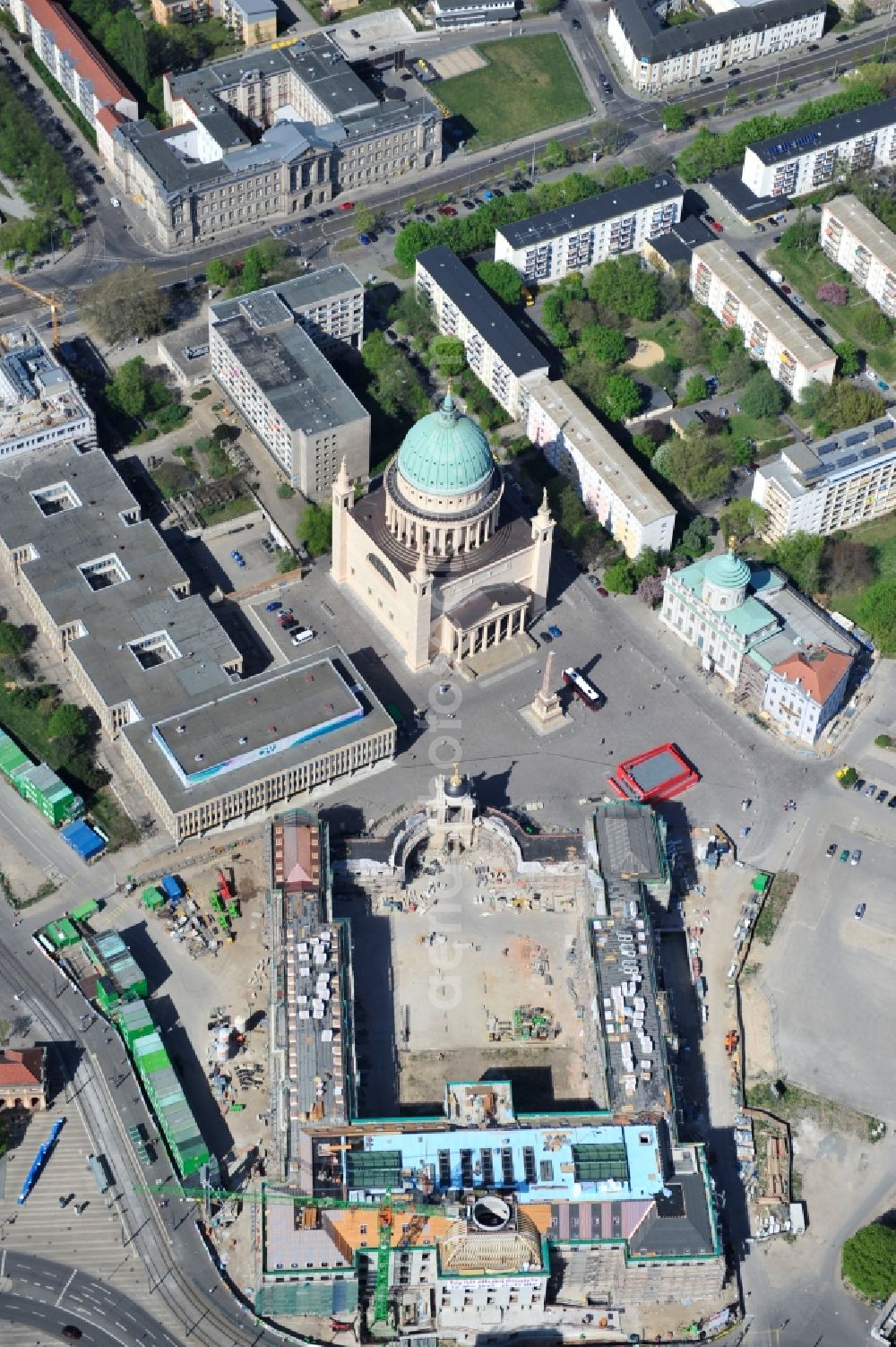 Potsdam from the bird's eye view: Construction site of the Potsdam Stadtschloss at the Old Market. In the background is the University of Applied Sciences Potsdam and St. Nikolai Church. Building contractors company: BAM Deutschland AG